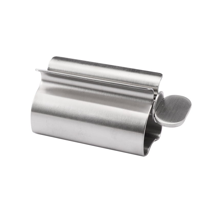 Stainless steel toothbrush holder with a sleek curved design and a small circular knob on the side from the stainless steel toothpaste squeezer and holder set.
