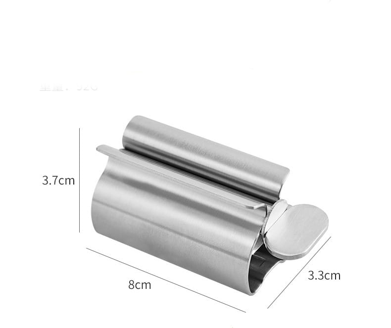 Stainless steel toothpaste squeezer and holder set featuring a sleek stainless steel can opener with a cylindrical design and smooth reflective surface.