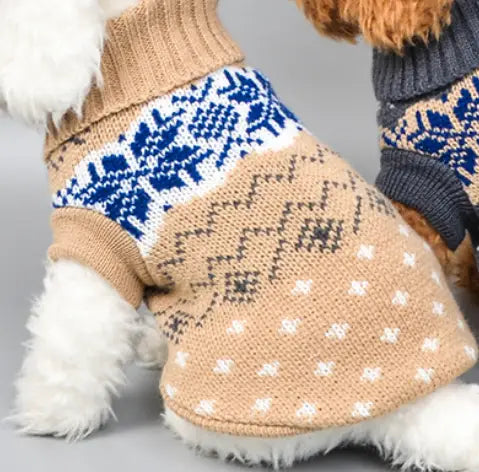 Tan knitted dog sweater featuring blue and white nordic-inspired snowflake patterns designed for winter pet apparel.