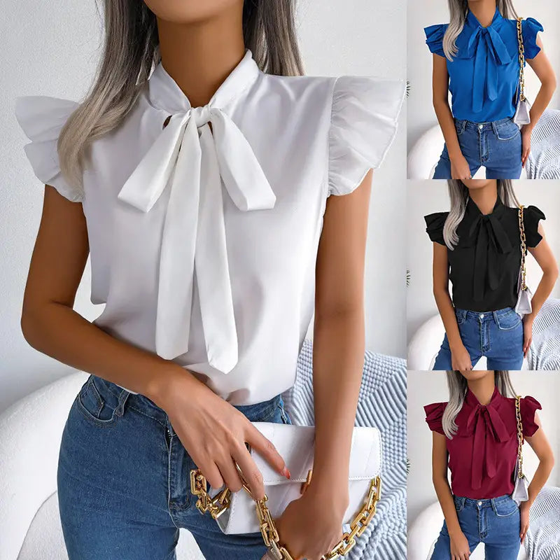 White blouse with ruffled short sleeves and a prominent bowknot at the neckline in a retro style.