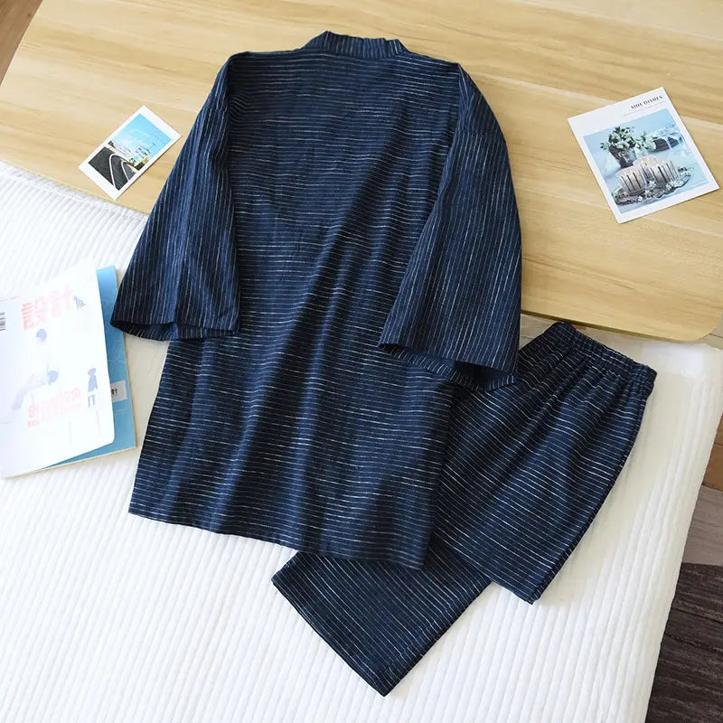 Navy blue striped cotton kimono pajama set for men with thin white vertical stripes and a relaxed loose fit.