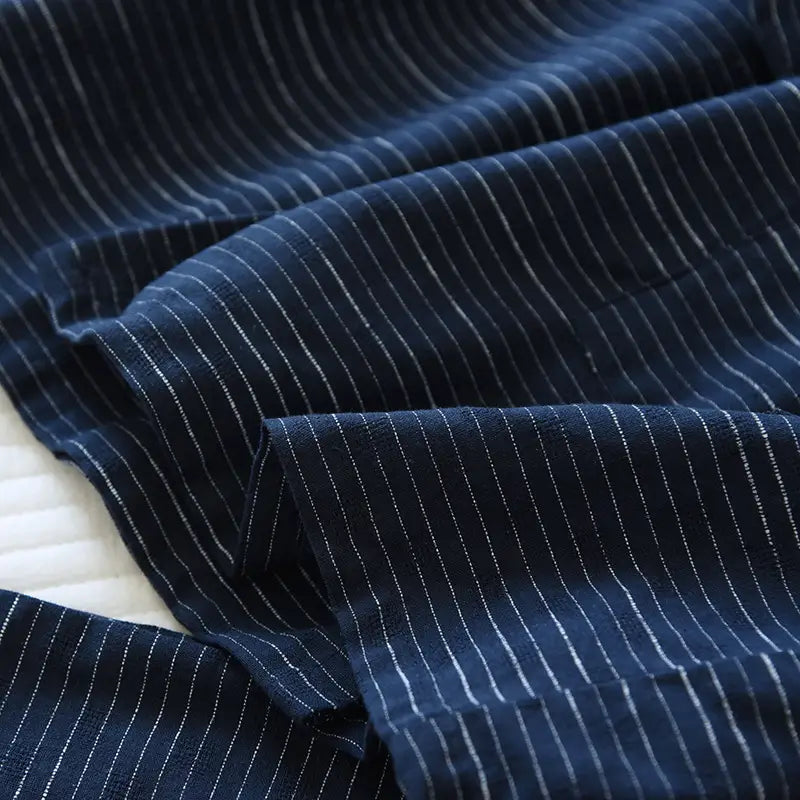 Deep navy blue striped cotton kimono pajama set for men with fine white pinstripes and a soft textured weave.