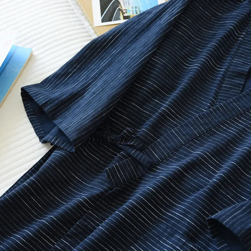Dark blue striped cotton kimono pajama robe for men with fine white pinstripes and traditional knot closure.