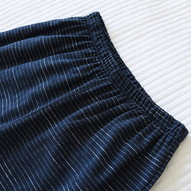 dark blue striped cotton kimono pajama pants for men with fine white pinstripes and an elastic waistband