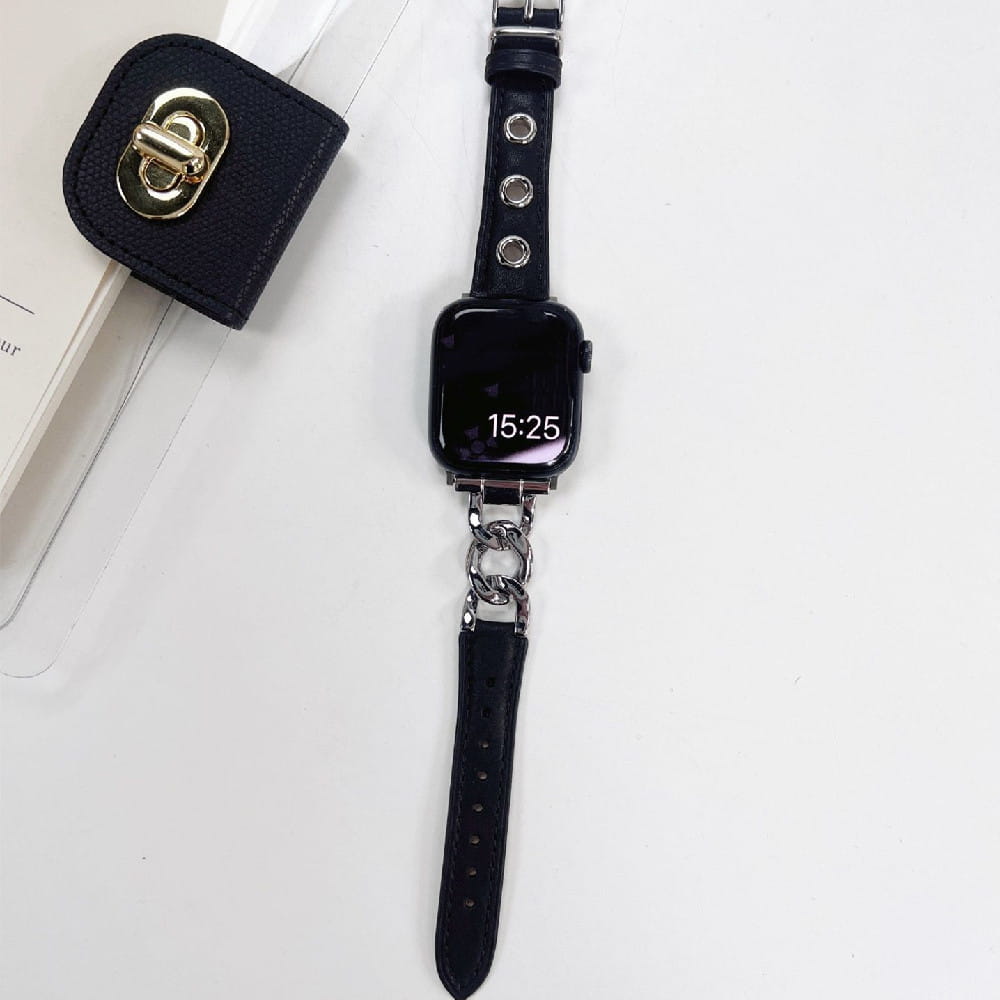 Black leather Apple Watch band with silver-toned chain link connector and circular metal studs featuring a retro design.