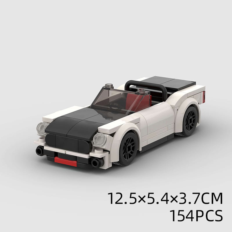 Voiture de sport cabriolet blanche et noire fabriquée à partir de briques en plastique imbriquées, avec des accents intérieurs rouges, de l’ensemble de blocs de construction pour voiture de course moc éducatif.