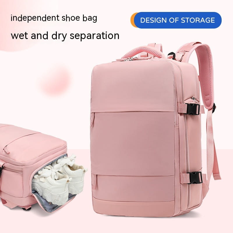 Waterproof laptop travel backpack in pink with mesh shoulder straps, black buckle closures, and a dedicated shoe compartment for wet and dry separation.