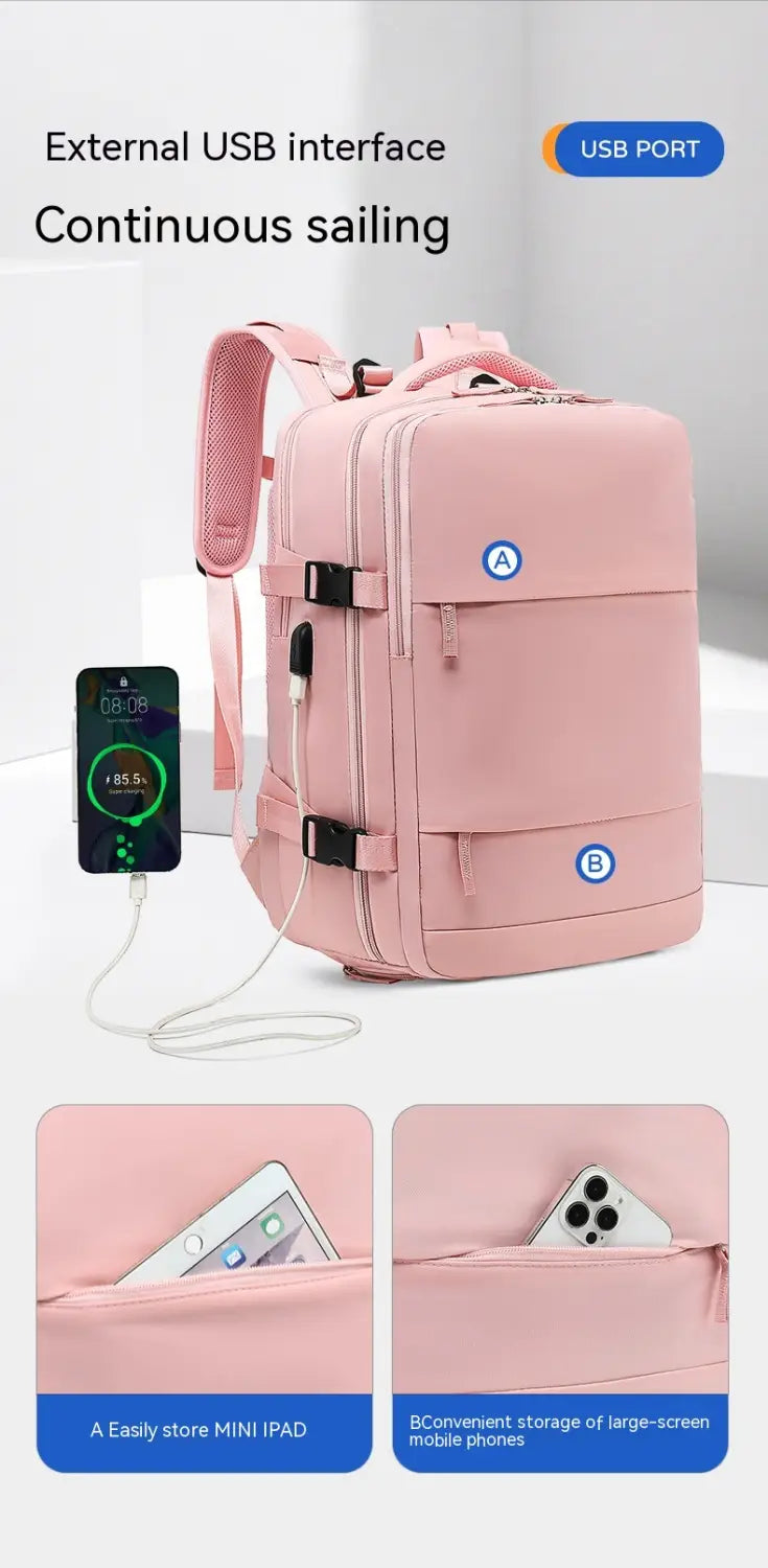 Pink waterproof laptop travel backpack with multiple compartments and external USB port for device storage.