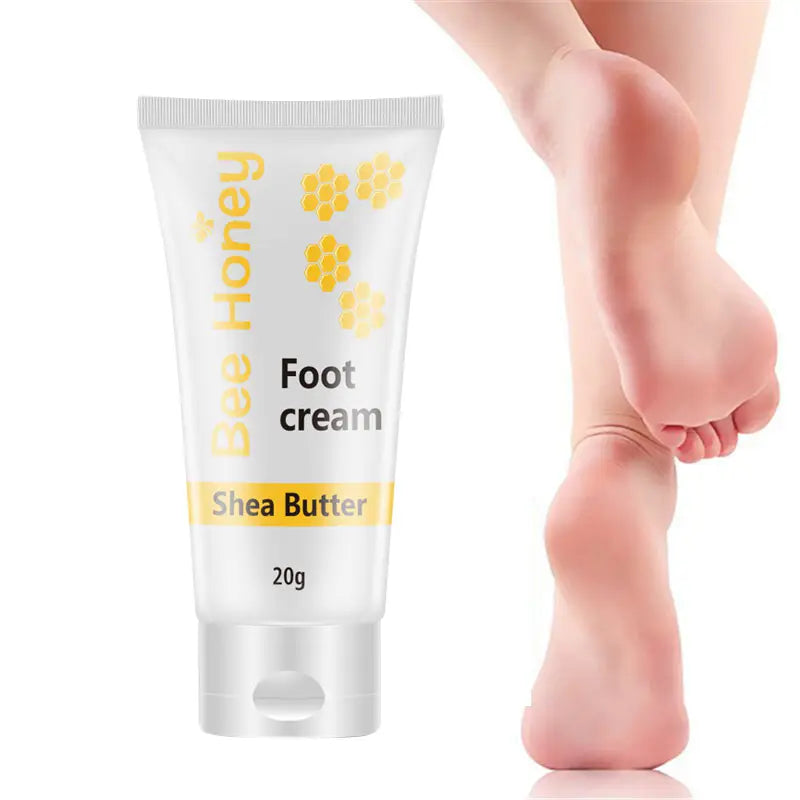 a white tube of honey foot cream with yellow honeycomb graphics and a silver cap labeled as containing shea butter in a moisturizing gel sock set