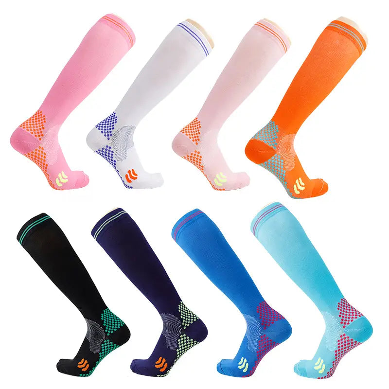 A collection of colorful compression soccer socks with breathable mesh panels and vibrant accent colors designed for athletic use.
