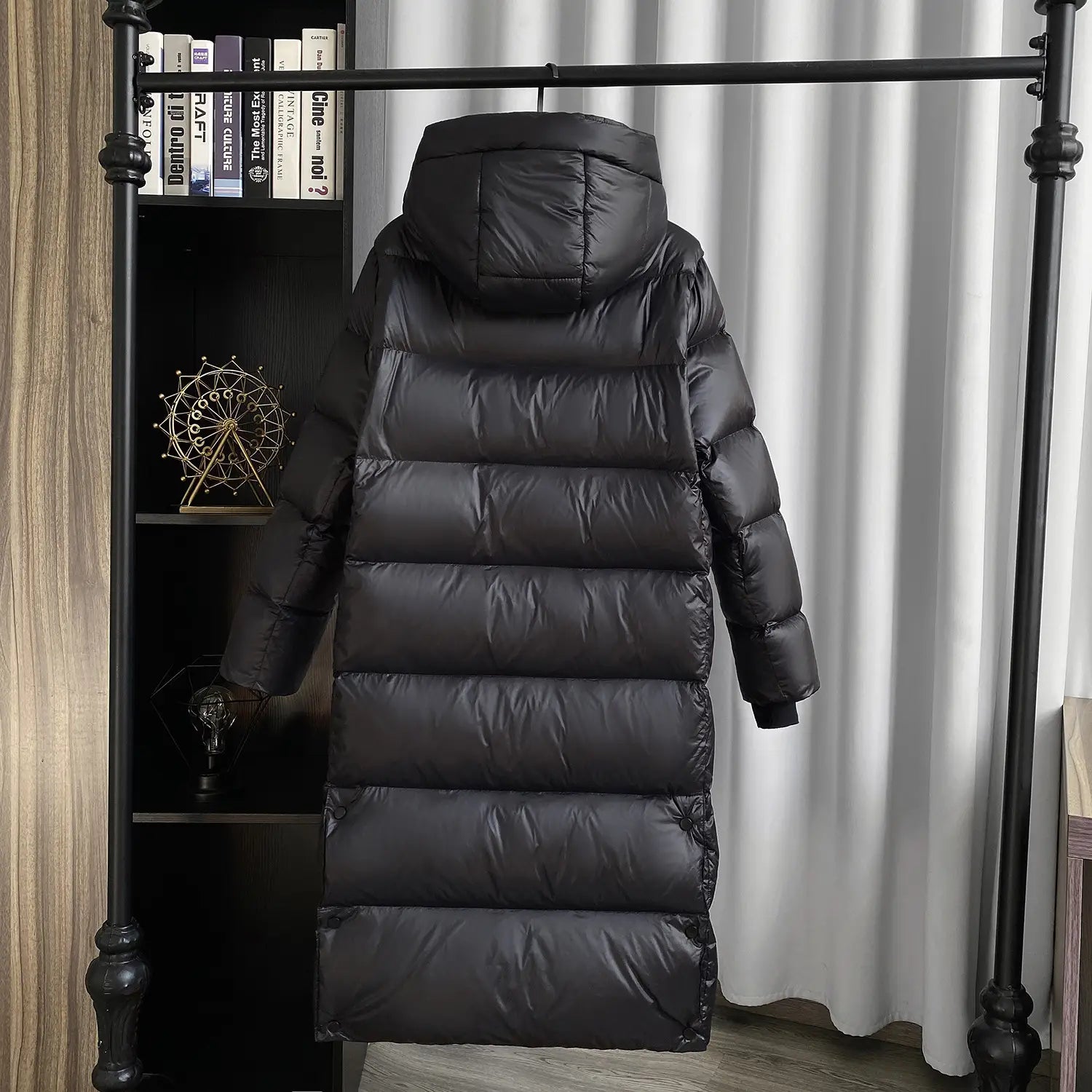 Black down jacket hooded quilted puffer coat featuring a black quilted design and hood.