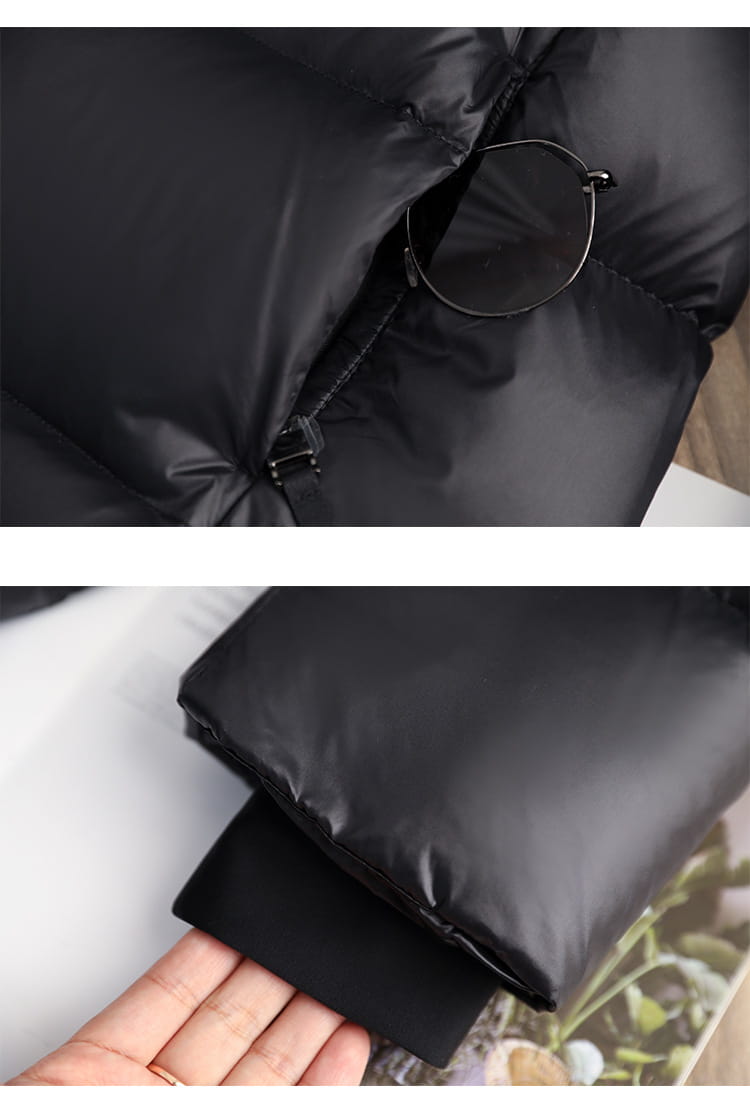 Black down jacket hooded quilted puffer coat with a shiny black quilted exterior and elasticized cuffs.