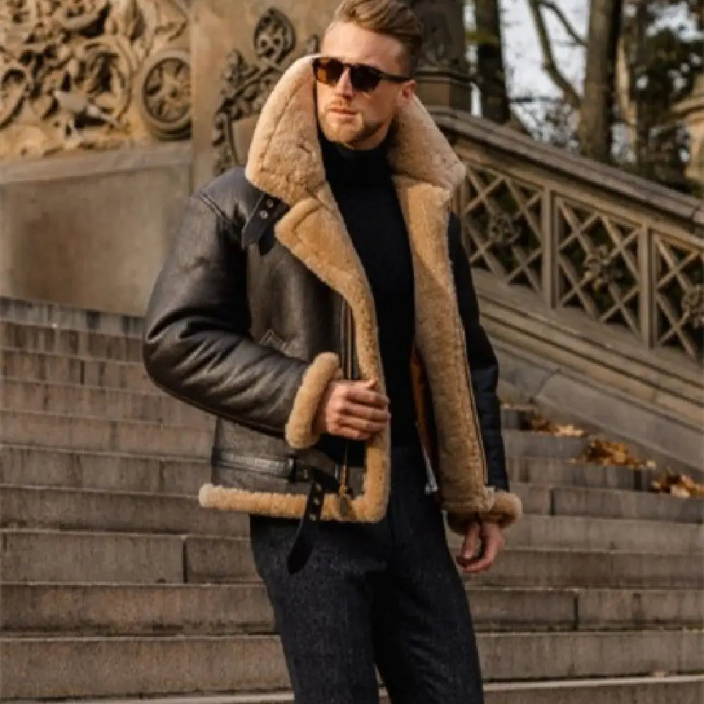 Men shearling bomber jacket in dark brown leather with tan shearling lining and collar displayed from the back side