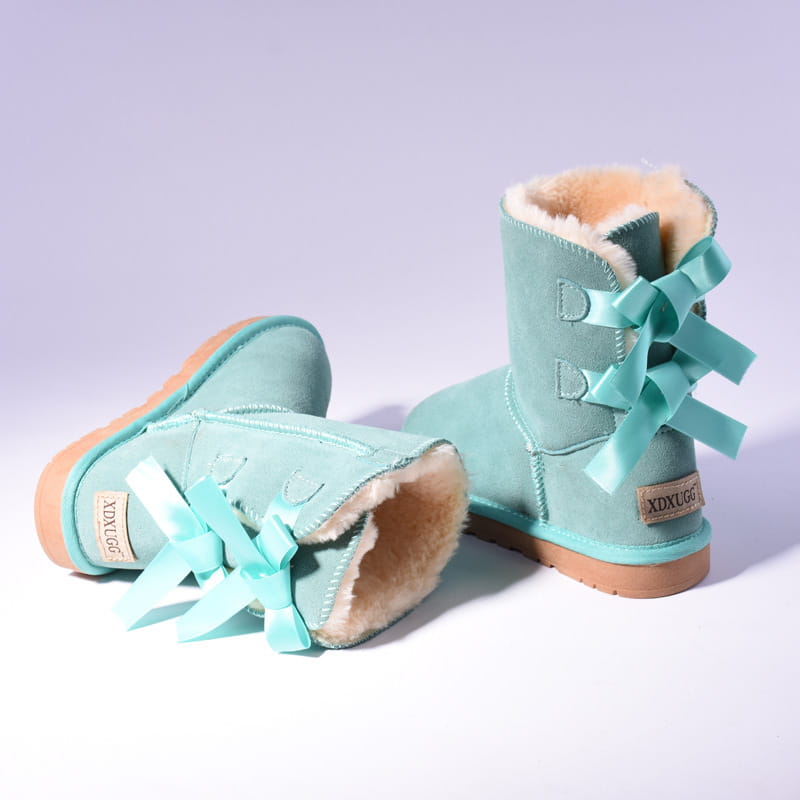 Women snow boots warm teal suede ugg-style ankle boots with matching bows and shearling lining for winter use.