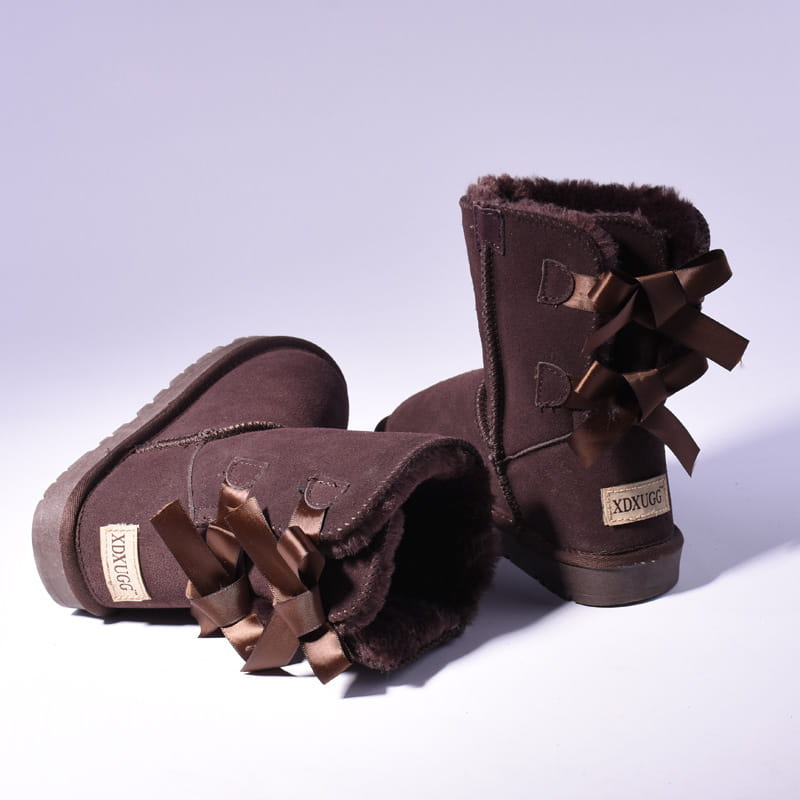 brown suede women snow boots with warm plush shearling lining and decorative satin bows on the back side designed for winter use