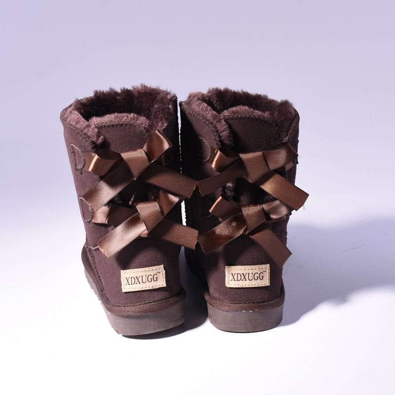 Women snow boots warm brown suede ugg-style ankle boots with plush fur lining and decorative satin bows.