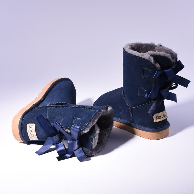 Women snow boots warm navy blue suede ugg-style ankle boots with plush gray fur lining and matching satin bows.