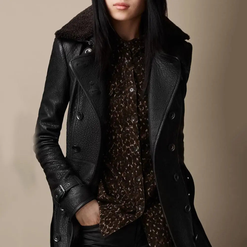 Black faux leather double breasted trench coat with belt featuring a plush brown shearling collar.