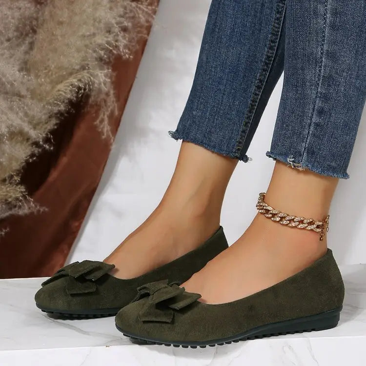 Women’s magenta suede bow round toe flat gommino loafers featuring matching bow accents for elegant wear.