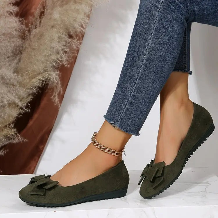 Women’s magenta suede bow round toe flat gommino loafers featuring matching bow accents for elegant wear.