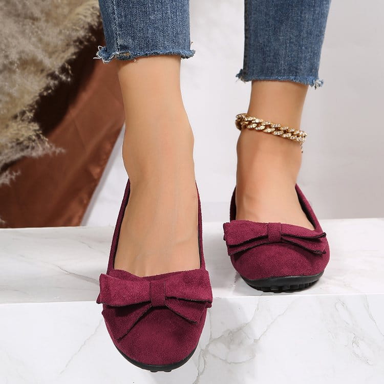 Women’s magenta suede bow round toe flat gommino loafers featuring matching bow accents for elegant wear.
