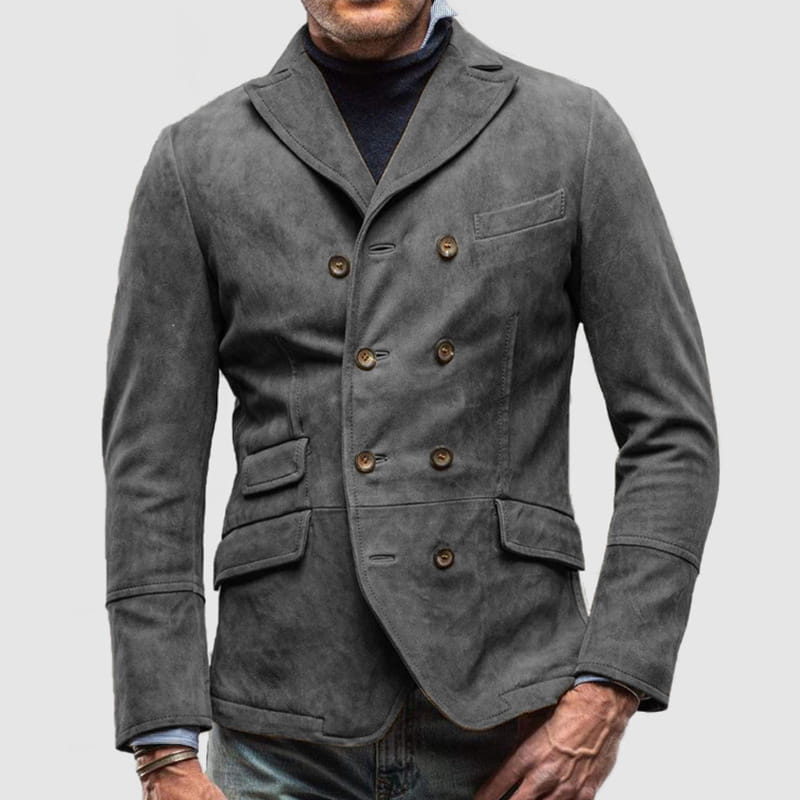 Chaqueta tipo blazer de ante para hombre de doble botonadura en color gris oscuro con botones de latón y bolsillos con solapa.