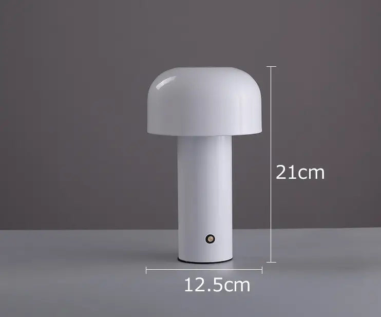 White mushroom-shaped cordless touch rechargeable LED table lamp with a smooth glossy finish and cylindrical base.