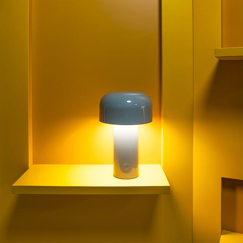A sleek, modern mushroom table lamp cordless touch rechargeable led with a matte blue dome and cylindrical white base.