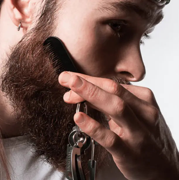 black plastic comb with keychain attachment included in beard growth kit with derma roller and serum set for grooming and styling facial hair