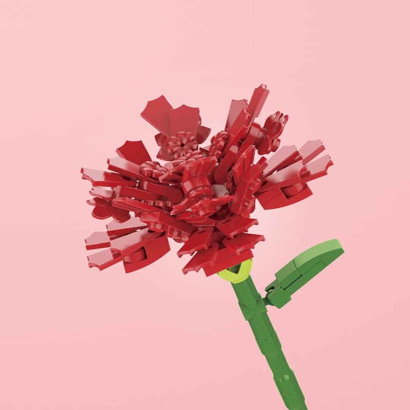 Une fleur en briques Lego rouges vives avec une tige verte et une feuille, réalisée à partir de briques en plastique imbriquées, dans un bouquet de fleurs en briques, rose bonsaï, jouet.