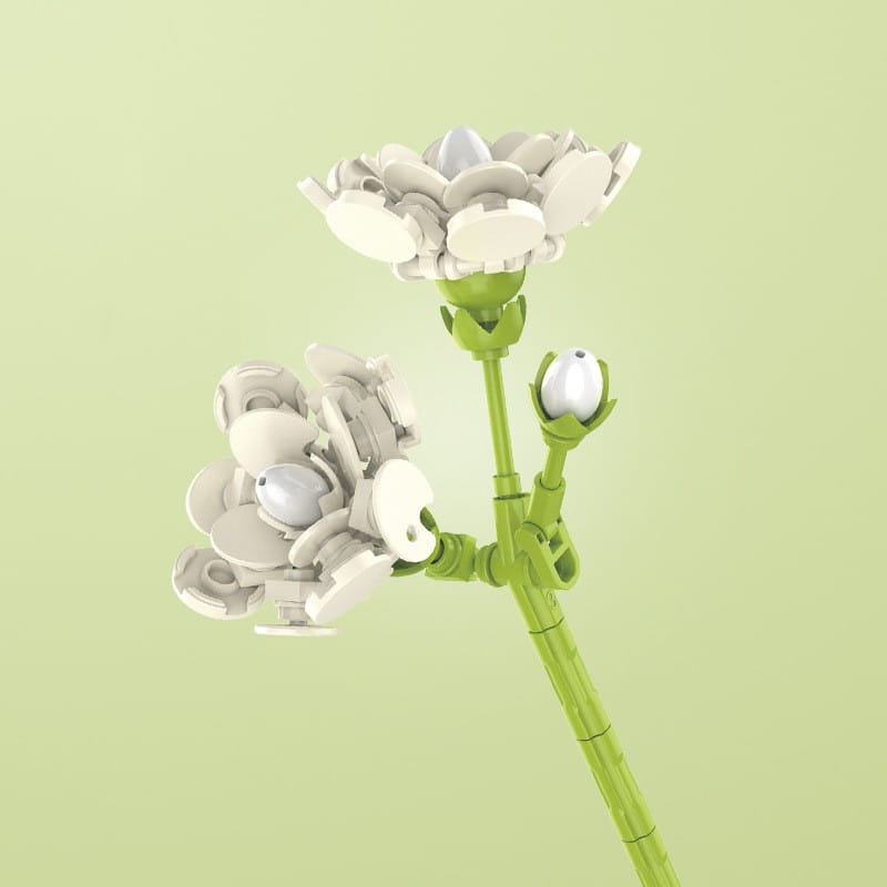 Un délicat bouquet de fleurs en briques, rose bonsaï, en blanc, avec des tiges vertes et des boutons floraux, façonné à partir de pièces de plastique imbriquées.