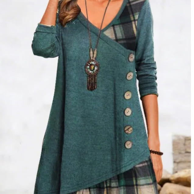 Teal asymmetrical knit tunic dress featuring a plaid patchwork panel and wooden buttons.