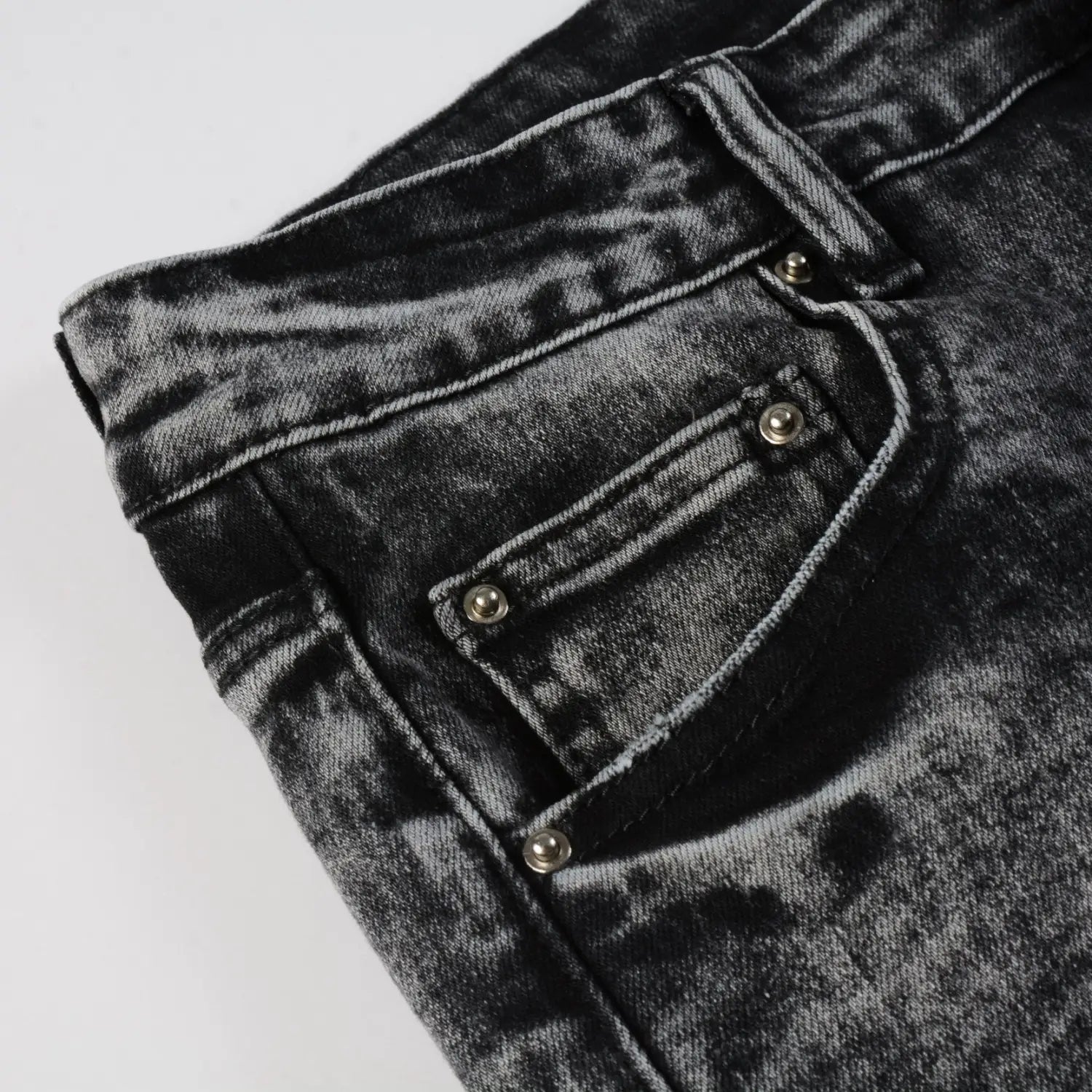 men’s smoky gray slim fit distressed retro skinny jeans made of black distressed denim with silver toned metal buttons and reinforced stitching