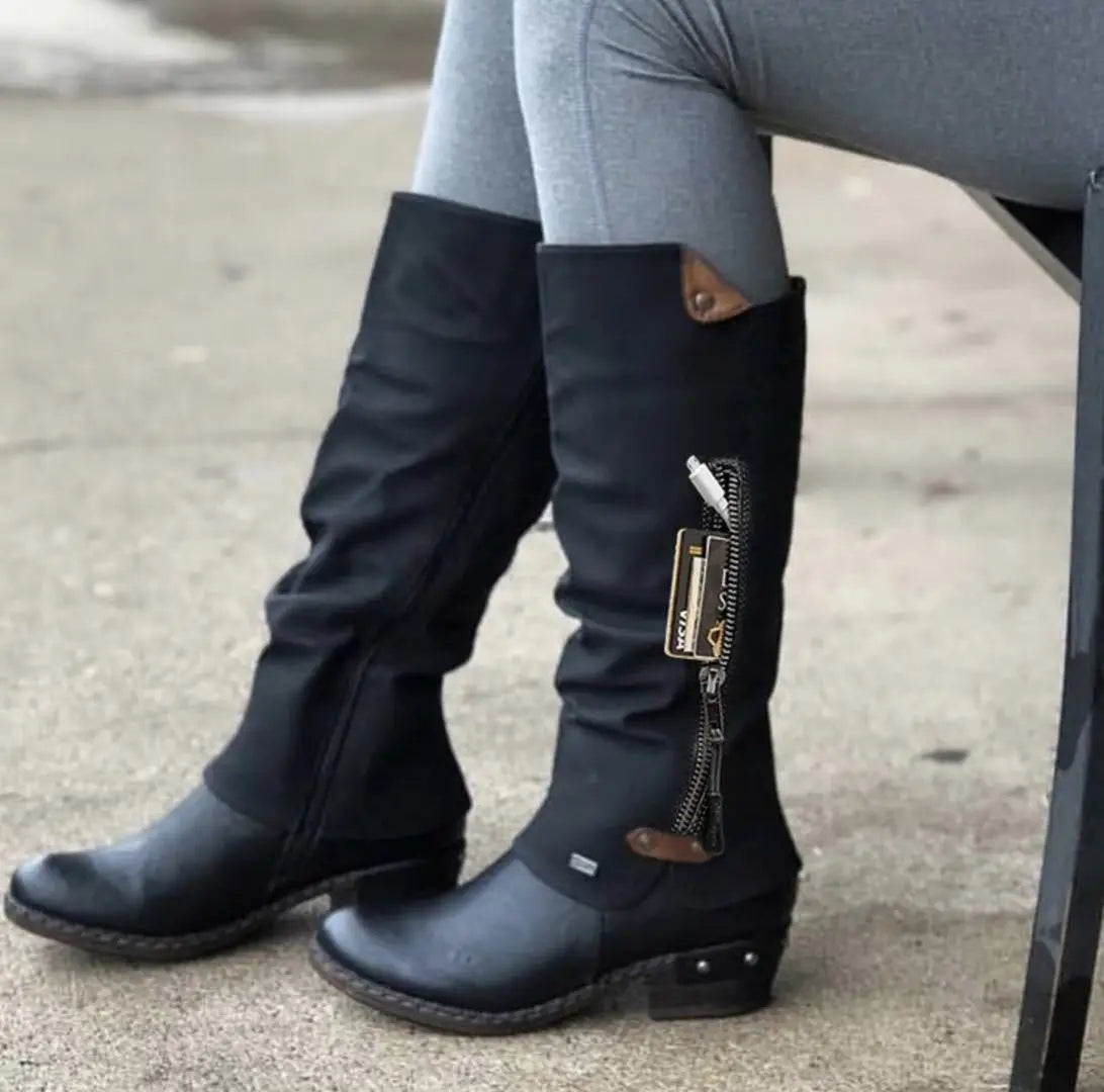 Black rieker knee high suede leather boots with block heel featuring a side zipper and leather accents.