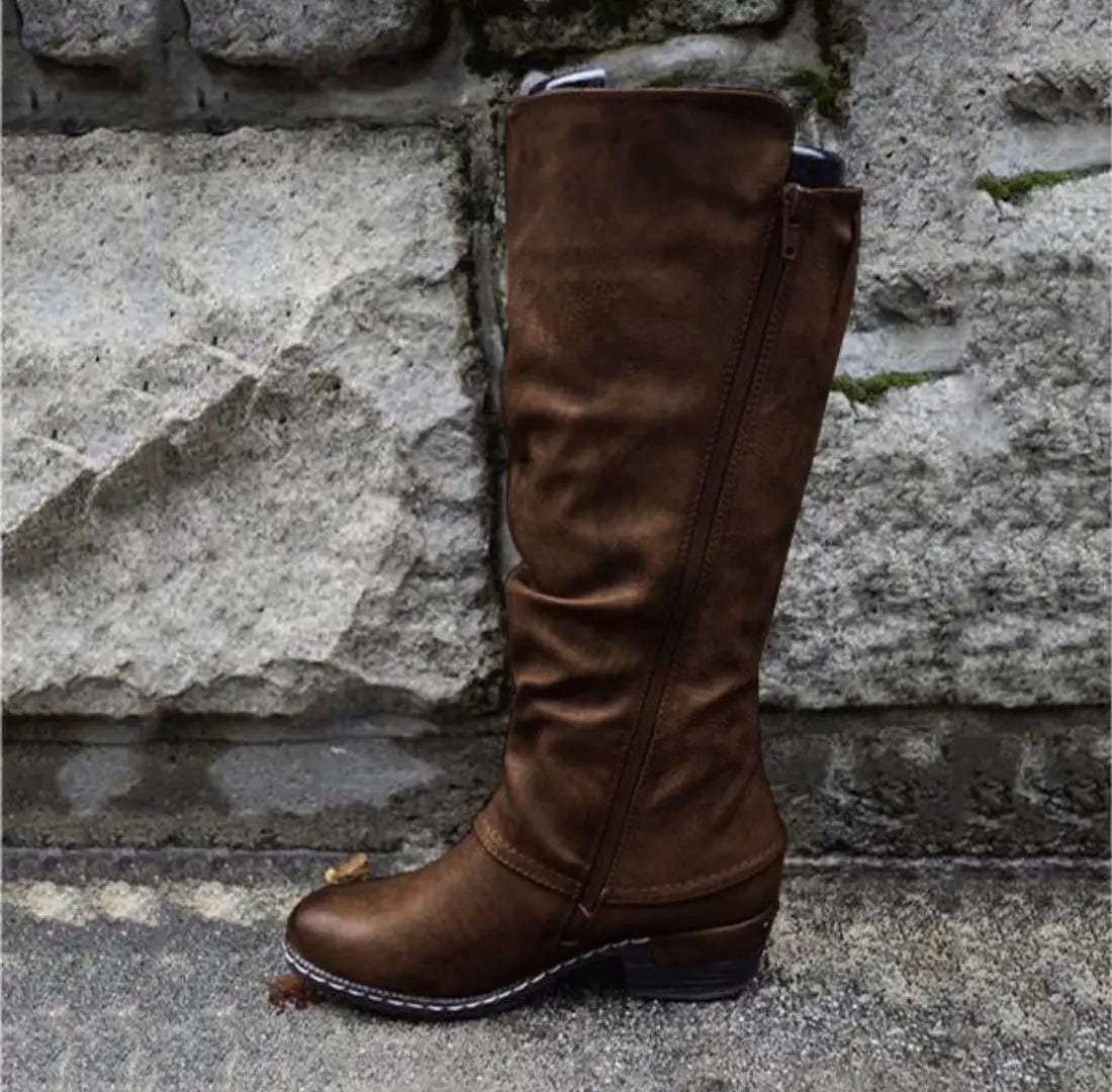 Brown suede knee high leather boots with a side zipper and low block heel.