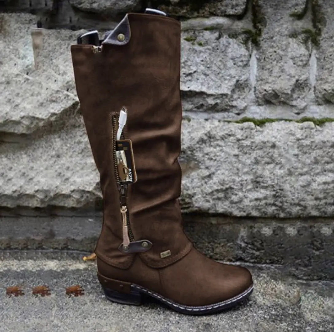 Brown suede knee high boot with leather accents and a side zipper featuring a block heel.