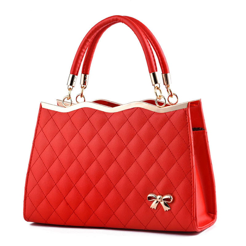Red quilted crossbody handbag featuring gold-tone bow and handles with gold hardware.
