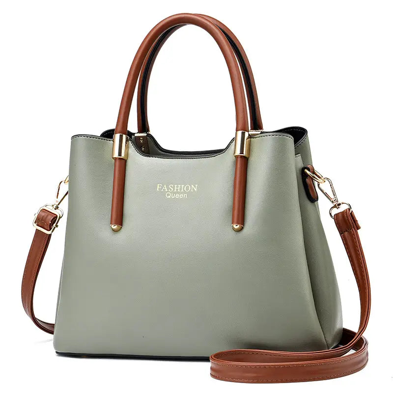 A stylish olive green and brown pu leather shoulder bag with gold-tone hardware featuring a structured design, dual top handles, and a detachable strap.