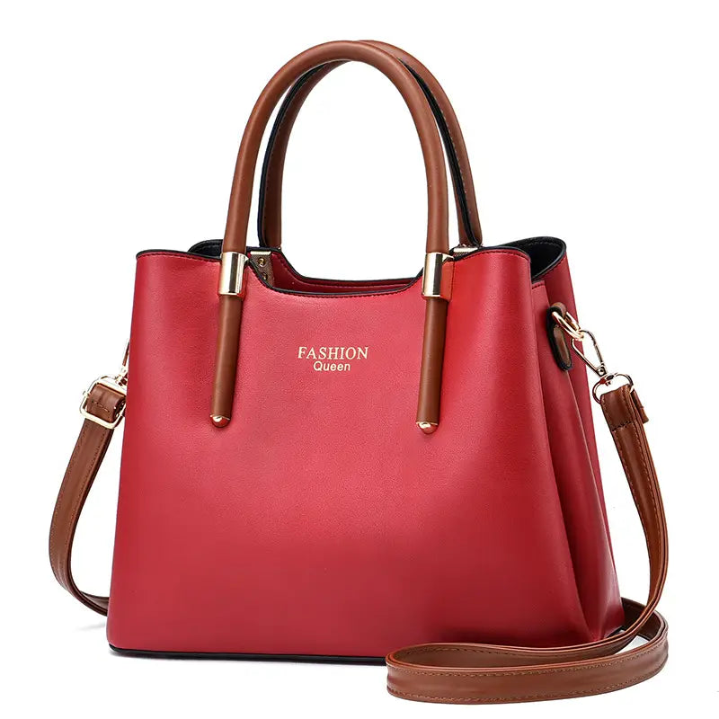 Red and brown pu leather shoulder bag with detachable strap and gold tone hardware.
