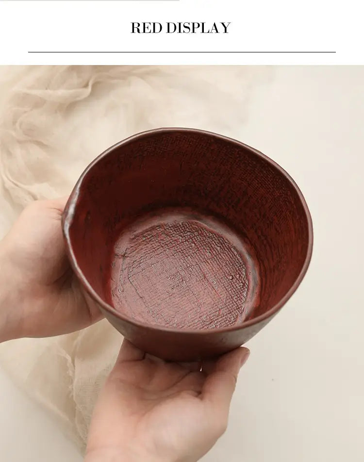 A rustic deep red ceramic rice bowl featuring a textured interior and a slightly uneven rim, handcrafted for retro style and ideal for soup or rice.