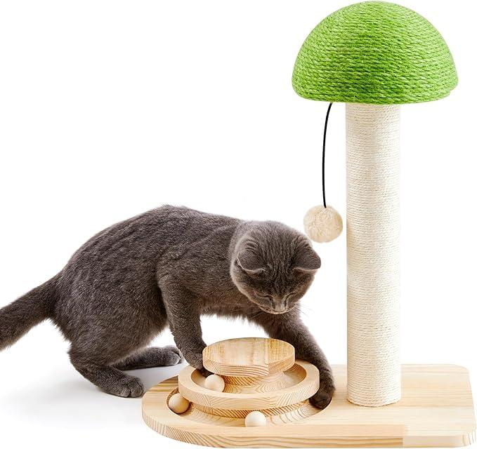 Green mushroom-shaped cat tree with beige sisal-wrapped scratching pole and wooden base featuring a circular ball track toy platform for cat entertainment.