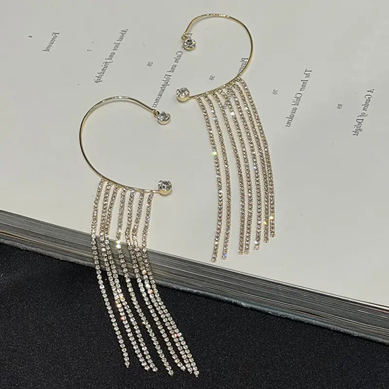 Gold-toned hoop earrings with multiple cascading strands of clear rhinestones 14k gold plated long drop crystal tassel earrings.