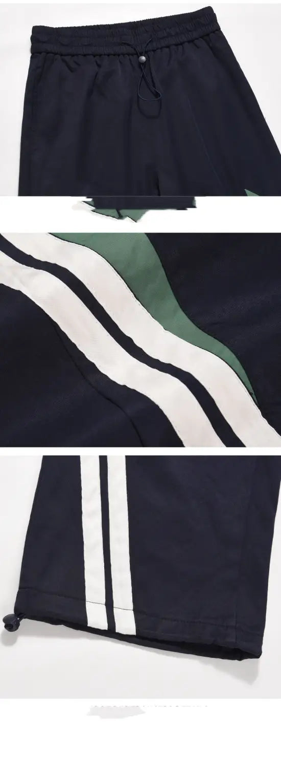 men’s retro striped athletic track pants in black featuring white and green side stripes and a drawstring waistband, suitable for sports and casual wear
