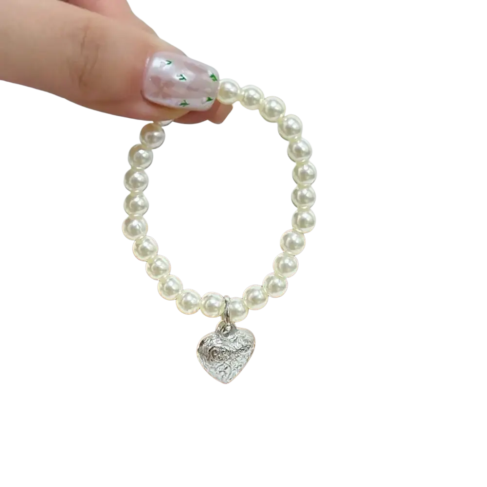 A delicate white pearl bracelet with a silver heart charm for a 17cm labubu doll summer bikini swimsuit set