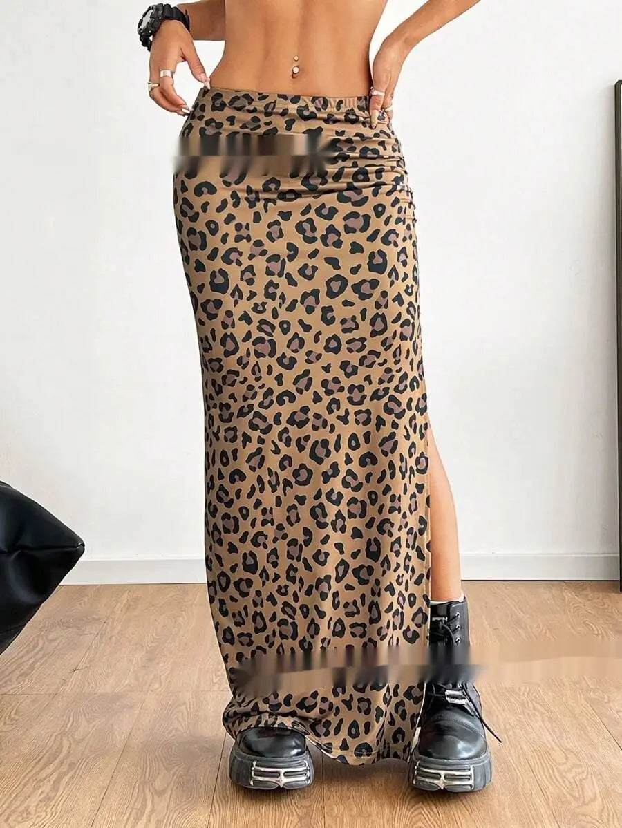 A tan and black leopard print high waisted maxi skirt with a side slit and ruched detail.