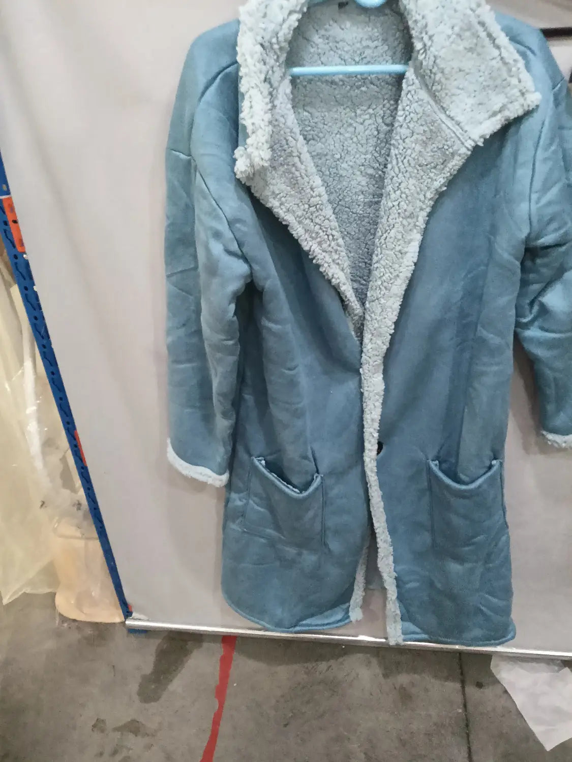 Light blue quilted coat with plush white sherpa lining and trim for winter wear titled furry long shearling winter coat.