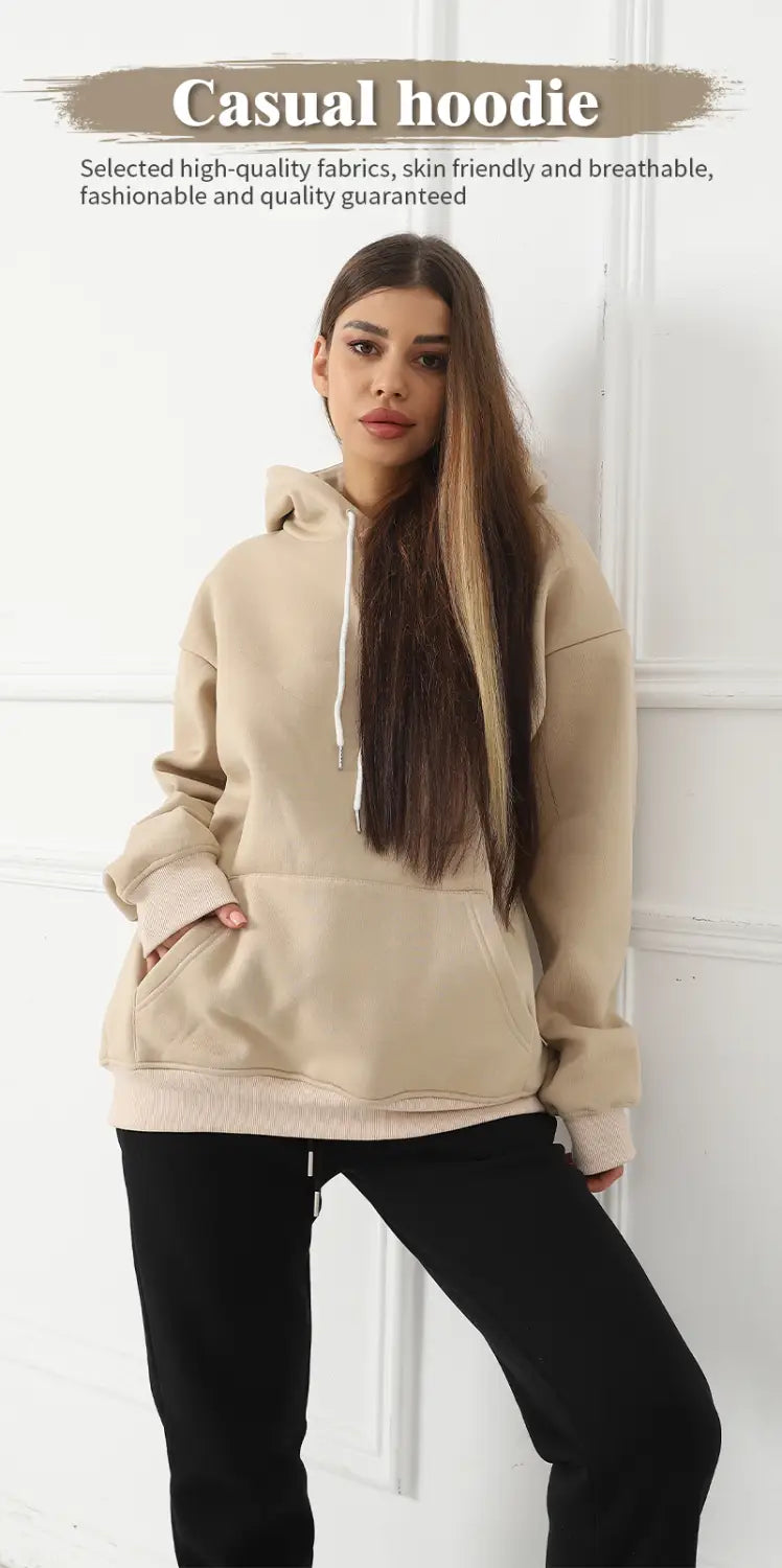 Beige women’s oversized casual hoodie with white drawstrings and front pockets featuring graphic print art.