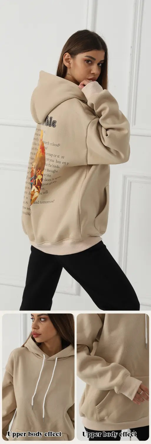 women’s oversized beige hoodie made of soft material featuring a graphic print on the back and white drawstrings for casual wear