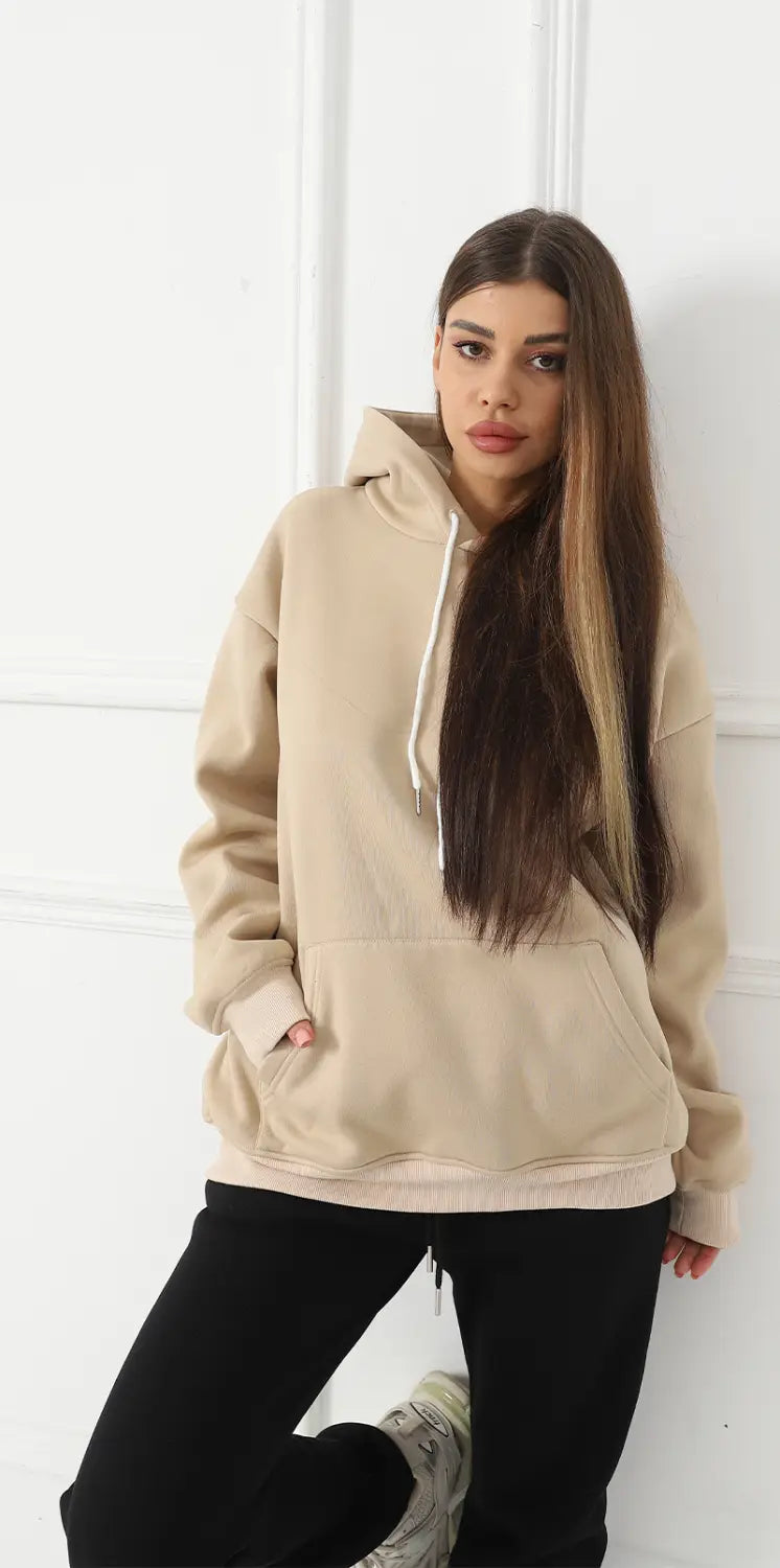 Beige oversized hoodie for women with white drawstrings and front pockets featuring a graphic print art design.