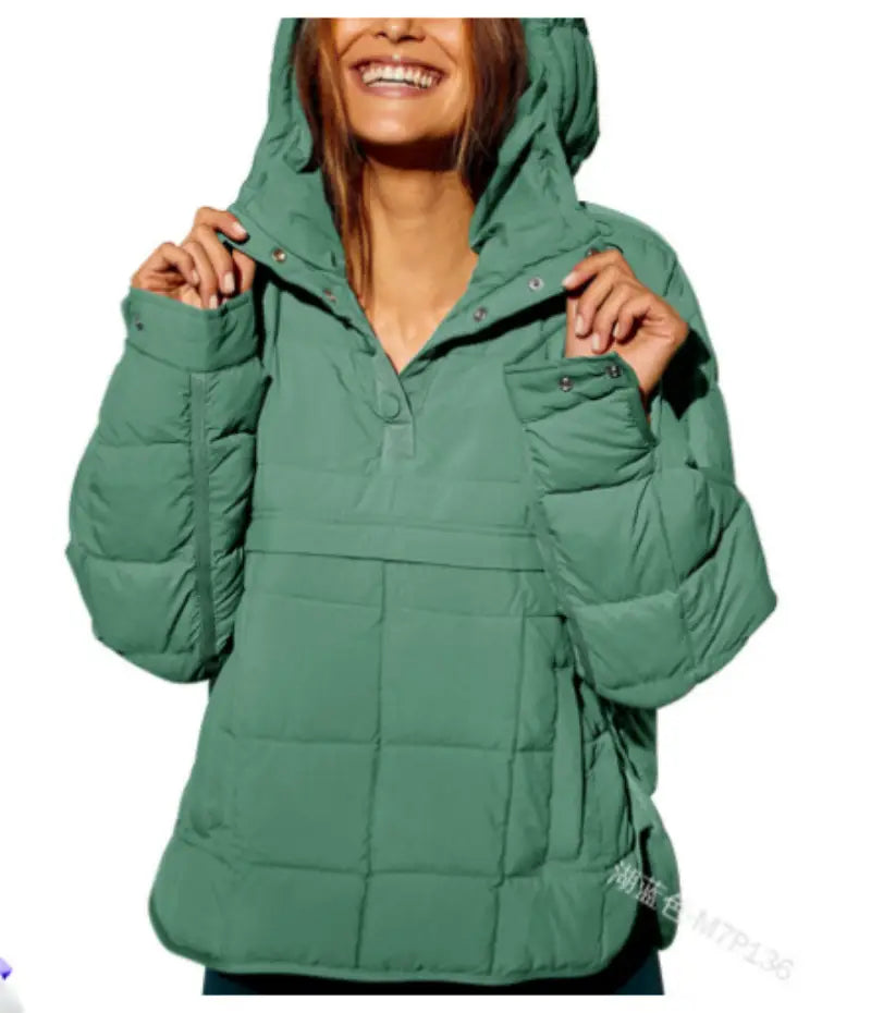 A cozy quilted green hooded puffer jacket for women featuring a front snap closure and two side pockets.